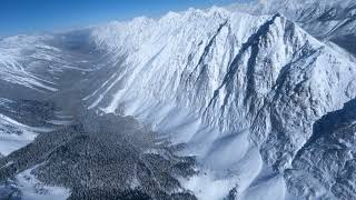 Helicopter over the Rocky Mountains from Canmore Alberta [upl. by Fisher836]