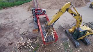 Morbark 6400XT Horizontal Grinder Processing Pallets Stumps and Yard Waste [upl. by Asined]