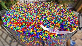 TRAMPOLINE FILLED WITH 160000 PLASTIC BALLS BALL PIT [upl. by Resneps]