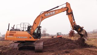 Case CX250C With An Engcon Tiltrotator Spreading Topsoil [upl. by Anha696]