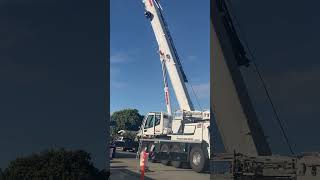 Liebherr LTM 110053 Mobile Crane Lifting and Moving Main Counterweight Onto Flatbed Truck [upl. by Nnylodnewg]