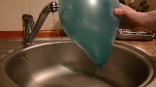 Electric force between the water and the balloon  physics experiment [upl. by Enelie640]