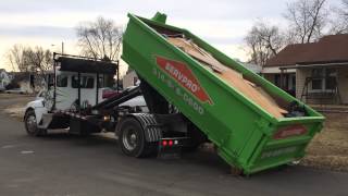 Kenworth Hook Lift picking up 15 yarder [upl. by Ahsinert74]