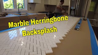 Marble mosaic Herringbone backsplash Install Time lapse [upl. by Lairbag]