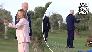 Biden appears to wander off at G7 summit before being pulled back by Italian PM [upl. by Enahsal150]