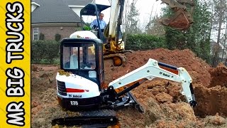 BIG BOBCAT DIGGER DUMPS ON TOY DIGGER  MrBigTrucks101 [upl. by Cooke]