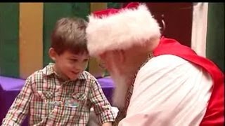 Caring Santa visits Austin children [upl. by Einnok233]