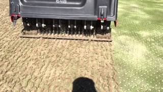 Golf course green aerification with Toro 648 Procore [upl. by Akenahs]