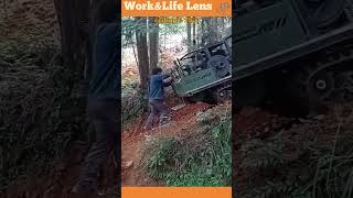 Worker uses tracked vehicle with hydraulic levelling to transport stones uphill efficiently [upl. by Rettig993]