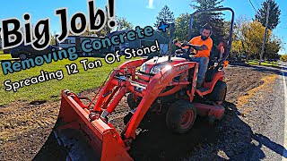 Digging out concrete Spreading 12 ton of stone  Grading Dirt [upl. by Atonsah557]