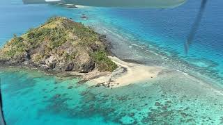 Scenic flight over celestial Kadavu Island Group and landing at Kokomo Private Island Resort Fiji [upl. by Aleakam92]