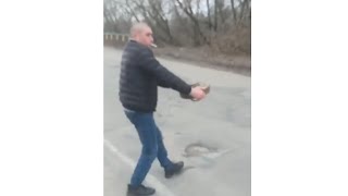 🔴 Russian War In Ukraine  Ukrainian Civilian Removes Landmine From Road Without Any Fear [upl. by Hofmann105]