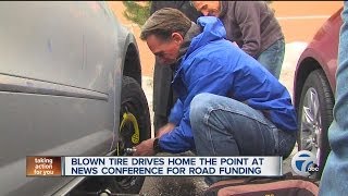 Blown tire drives home the point at news conference for funding [upl. by Sheilah]