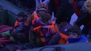 Migrants leave for England from a French beach [upl. by Yelsgnik]