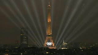 Eiffel Tower illuminates during the Olympic opening ceremony  AFP [upl. by Anuahsed]