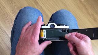 How to load 35mm film into a camera  two minute guide [upl. by Haerb]