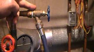 How to remove the air out of your hot water heating systemgirgling noise [upl. by Eiloj]