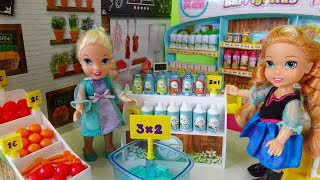 Elsa and Anna toddlers go shopping at the supermarket and buy toys [upl. by Haynor]