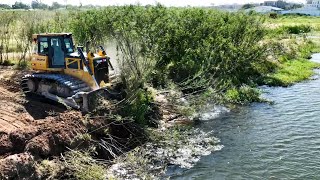 Nice Working Shantui Bulldozer Clearing Grass Into Water [upl. by Aihsinyt612]