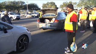 Thousands wait for hours to get Thanksgiving supplies in Downtown Jacksonville [upl. by Coletta]