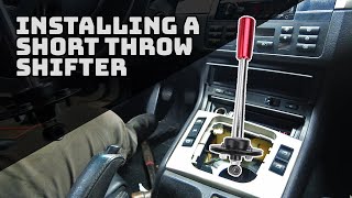 Installing a solid mount short throw shifter on our E46 track car 2002 BMW 325i [upl. by Enylecoj]