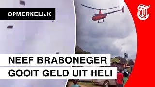 Surinaamse politicus strooit met geld uit helikopter [upl. by Kinelski]