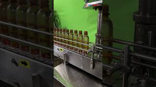 AUTOMATIC OIL BOTTLE CAPPING MACHINE [upl. by Katina]