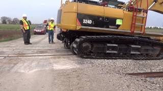 Cat 324HRE Low Auto Guide with Rubber Track Pads Video  Mitchell Rail Gear [upl. by Sulecram]