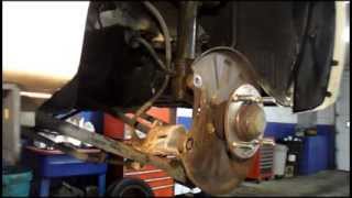 How To Replace Rear Brakes And Rotors On a 2004 KiaSpectra [upl. by Wertheimer53]