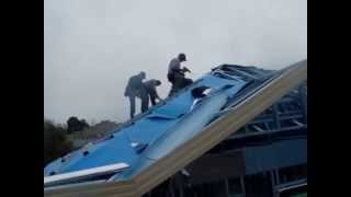 Installing roofing foil as sarking on a metal framed roof [upl. by Ursula]