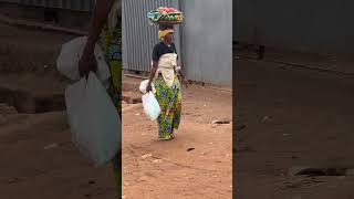 Rwanda lady carrying a basket of fruit on her head [upl. by Judi]