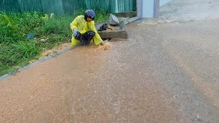 Unclog Culvert Drain Releasing Water That Flooded Street Drain [upl. by Tatum]