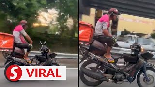 Food delivery rider nabbed over dangerous bike stunt [upl. by Natfa]