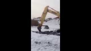 Showtime Fabrication Frost Ripper tearing up frozen Minnesota ground Kobelco SK170 [upl. by Treacy]