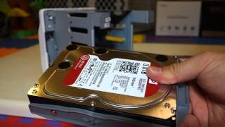 How to Setup Synology DS413j  Installing The Hard Drives [upl. by Berrie]