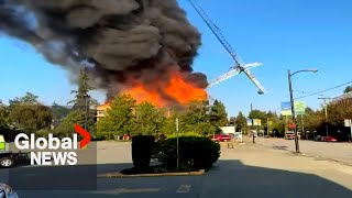 Massive fire in Vancouver brings down crane destroys home [upl. by Herold623]