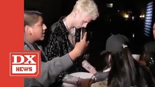 Machine Gun Kelly Signs Autograph Then Immediately DESTROYS It After Fan Brings Up Eminem [upl. by Ybab]