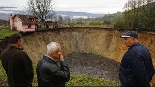 BOSNIAN RESIDENTS SHOCKED AS MASSIVE SINKHOLE OPENS UP SWALLOWING VILLAGE POND NOV 26 2013 [upl. by Dag]