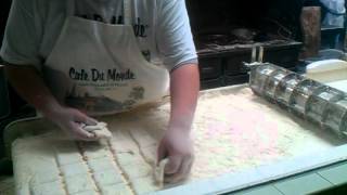 Beignets being made at Cafe Du Monde in New Orleans LA [upl. by Bywaters]