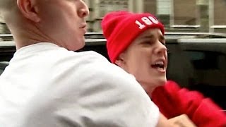 Justin Bieber hits out at photographers in London [upl. by Enirehtacyram]