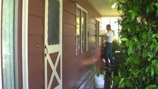 Washing a House Wood Siding Using Soap and a Brush [upl. by Lyrej]