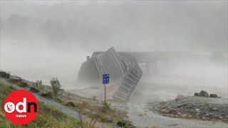 Bridge washed away by raging floodwater in New Zealand [upl. by Erasme]