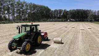 John Deere 5E making Small Round Hay Bales with Mini Round Baler 5067E [upl. by Iman]