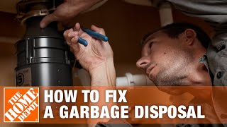 How to Fix a Garbage Disposal  The Home Depot [upl. by Aicak]