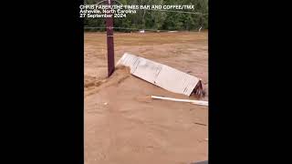 Shipping container being swept away in powerful flooding in Asheville [upl. by Adner]