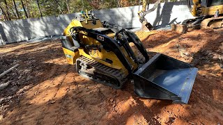 Spreading Rock and Backfilling foundation with Vermeer S450TX Mini Skid Steer [upl. by Lilah]