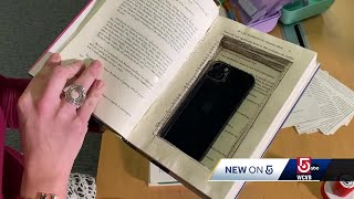 Librarian outfitting books with lifesaving phones info [upl. by Bracci]