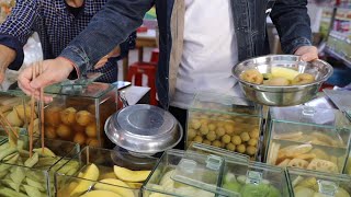 GLOBALink  Foreign vloggers impressed by sour snack in Chinas Guangxi [upl. by Assena996]