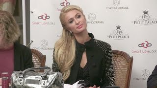 Paris Hilton tries to sell some weird app thing in Paris while on a tour to save the world with love [upl. by Intyre]