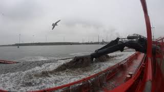 Suction Hopper Dredger loading inland vessels with sand [upl. by Anaerda691]